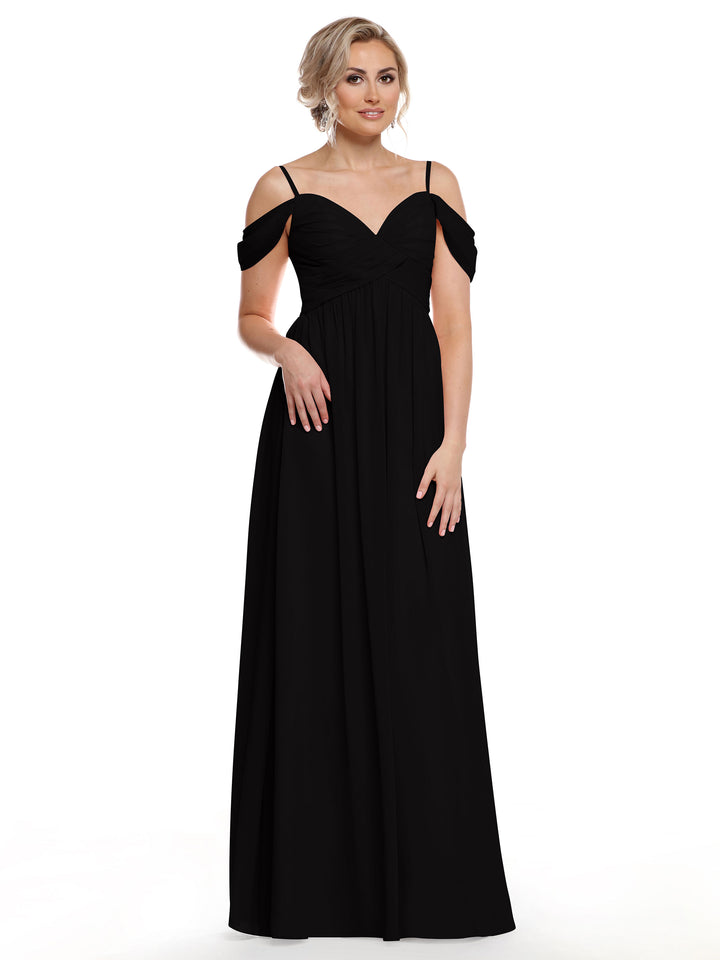 A woman models Avery Austin’s 80142, a long black cold shoulder dress with thin straps. She stands against a plain white background, her blonde hair styled up as she gazes slightly to the side.