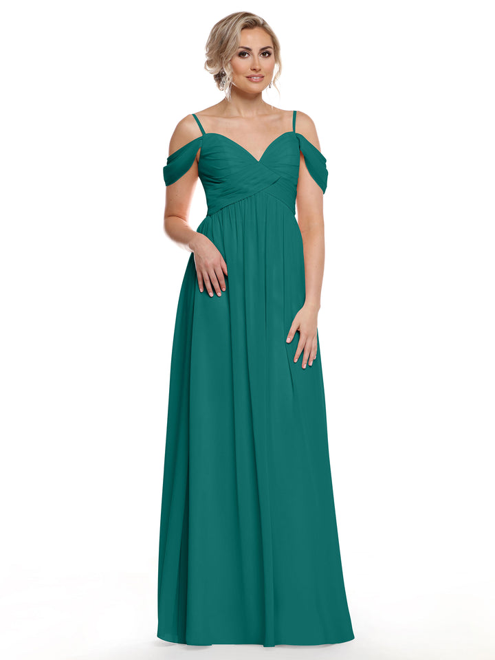 A woman with light hair styled up and earrings models Avery Austin’s 80142— a floor-length, teal green cold shoulder dress with thin straps and off-the-shoulder sleeves—against a white background.