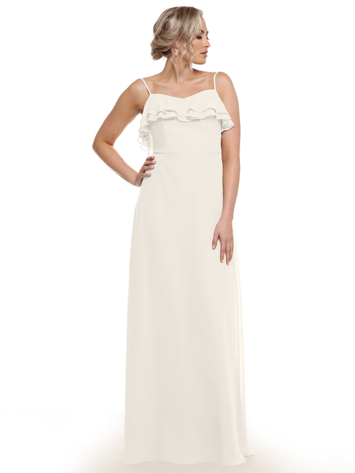 A woman models the Avery Austin 80146—a sleeveless, floor-length chiffon A-Line dress with thin straps and tiered ruffles at the chest—against a white background, highlighting its elegant and dimensional design.