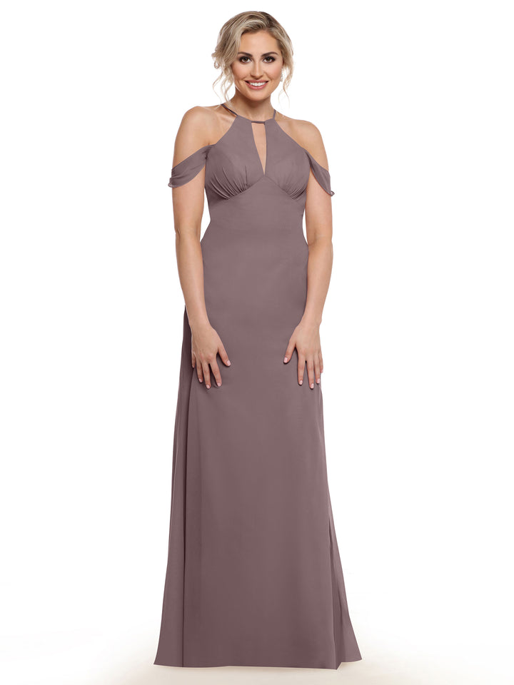 A woman smiles in the Avery Austin 80148, a floor-length mauve dress with a halter neckline, chiffon cap sleeves, and a chest keyhole cutout, set against a plain white background.