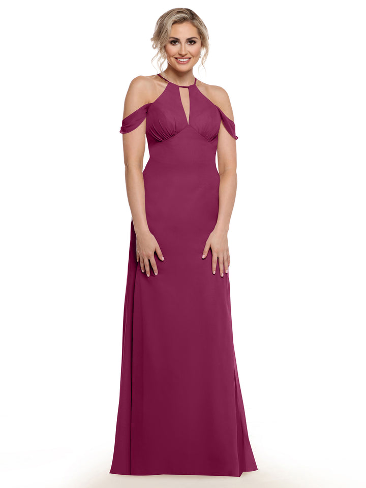 A woman models Avery Austin style 80148, a floor-length magenta gown with a keyhole neckline, chiffon cap sleeves, and ruched bodice detailing, set against a plain white background.