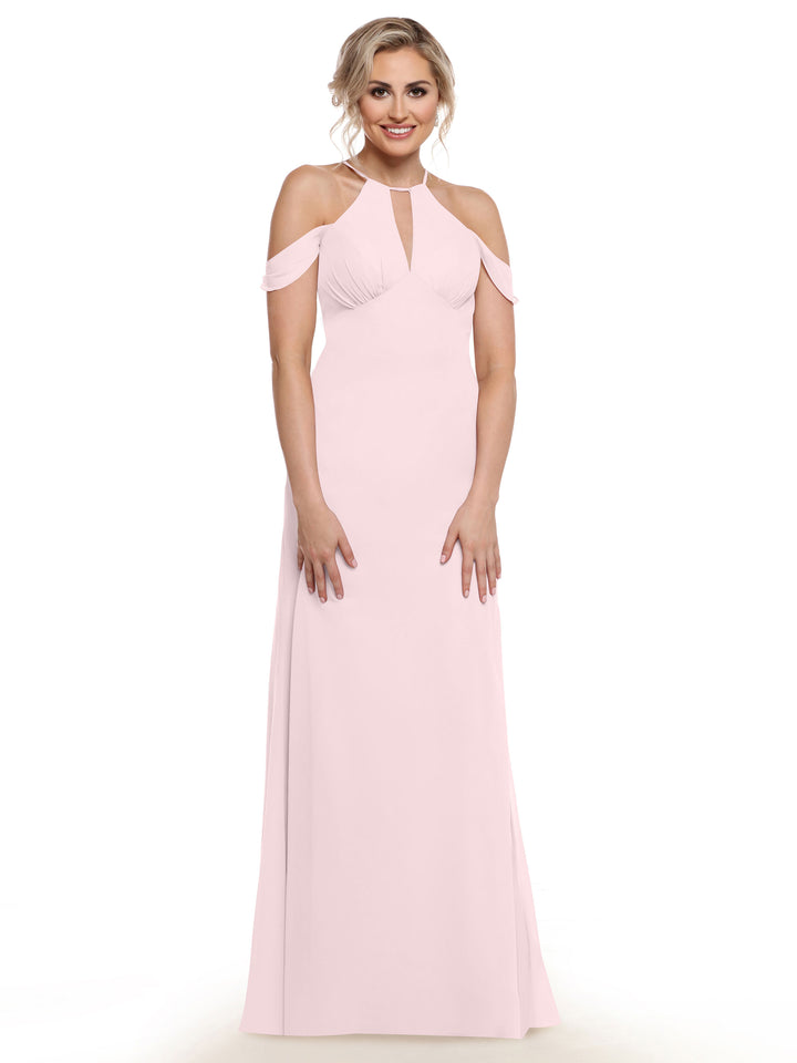 A woman in the Avery Austin 80148, a pale pink floor-length gown with chiffon cap sleeves and a keyhole neckline, smiles against a plain white background.