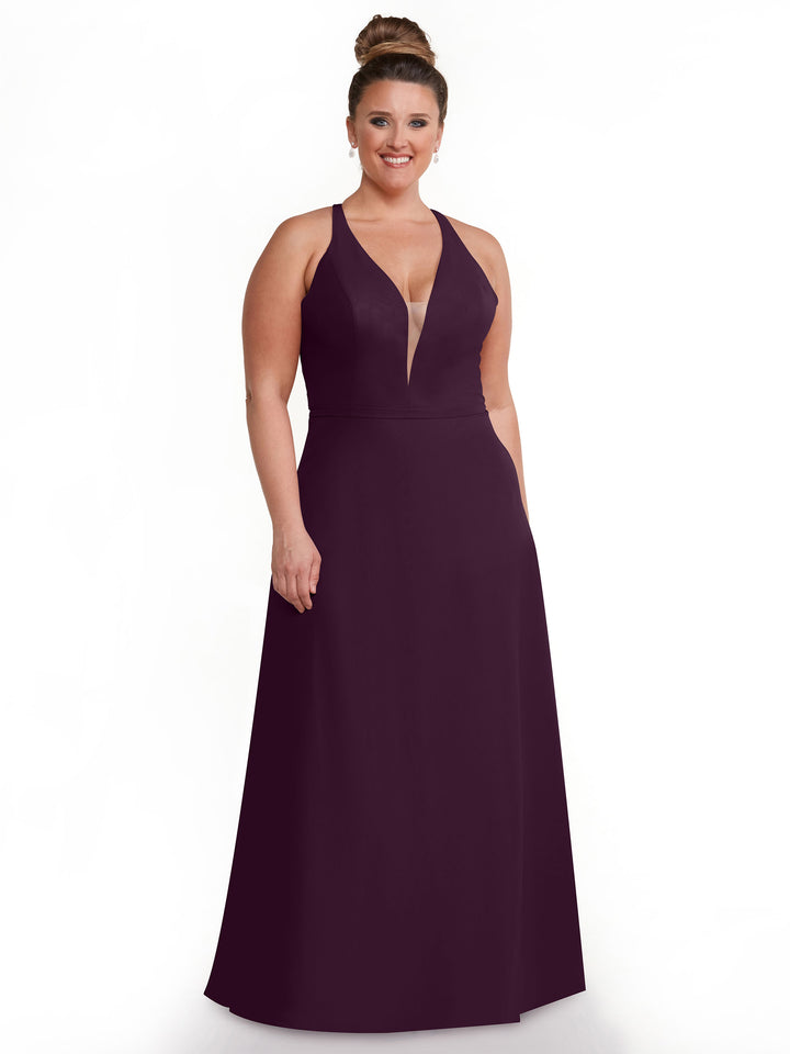 A woman with brown hair in a high bun wears Avery Austin&