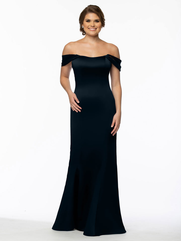 A woman with short brown hair smiles as she models Avery Austin&