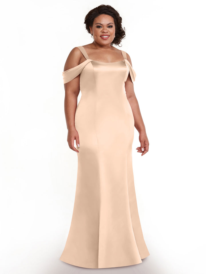 A woman smiles in the Avery Austin 80151, a floor-length, off-the-shoulder fitted dress with thin straps, elegantly showcased against a plain white background.