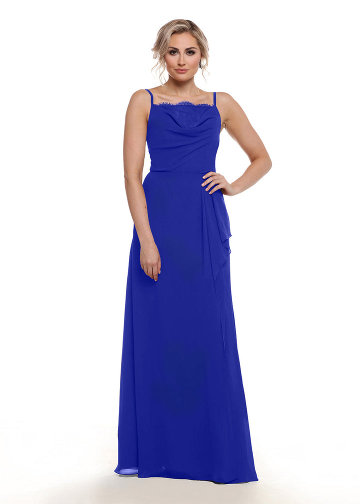 A woman poses against a white background in Avery Austin’s 80152: a royal blue, sleeveless chiffon A-line dress with thin straps, lace bust, draped bodice, and subtle side slit. Her light hair is up and she wears a neutral expression.