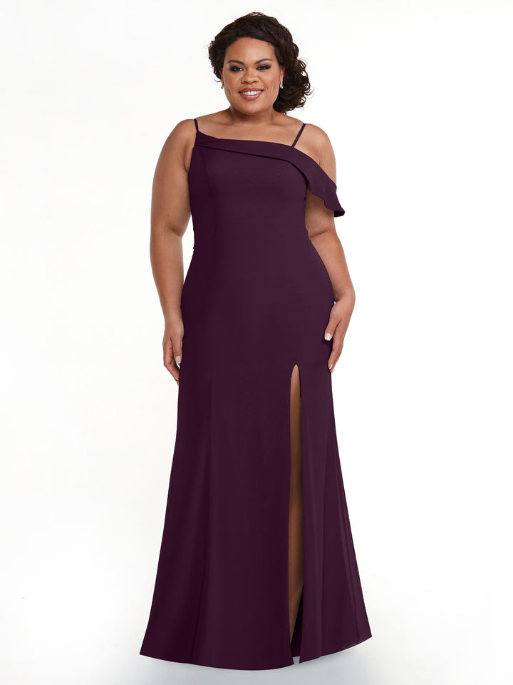 A woman wears Avery Austin’s 80153: a sleeveless, floor-length dark purple chiffon bridesmaid dress with asymmetric ruffle detail and front slit, smiling against a plain white background.