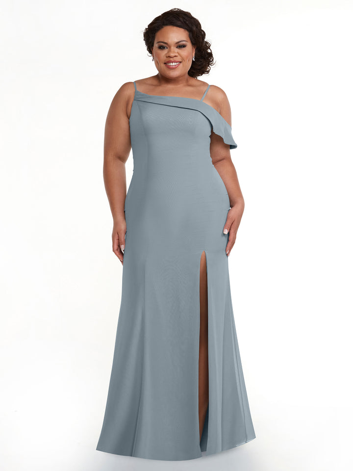 A woman smiles against a white background wearing Avery Austin’s TH-80153: a dusty blue chiffon bridesmaid dress featuring a floor-length fit-and-flare silhouette, thigh-high slit, and asymmetrical neckline.