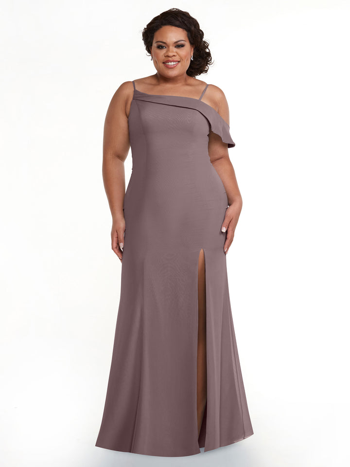 A woman smiles against a white background wearing Avery Austin 80153, a mauve chiffon bridesmaid dress featuring an asymmetrical neckline, ruffle detail on one shoulder, and a front slit.