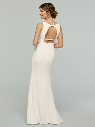 A woman stands with her back to the camera wearing Avery Austin’s 80155—a long, sleeveless white chiffon dress featuring a fitted, floor-length silhouette with a keyhole back and two horizontal straps.
