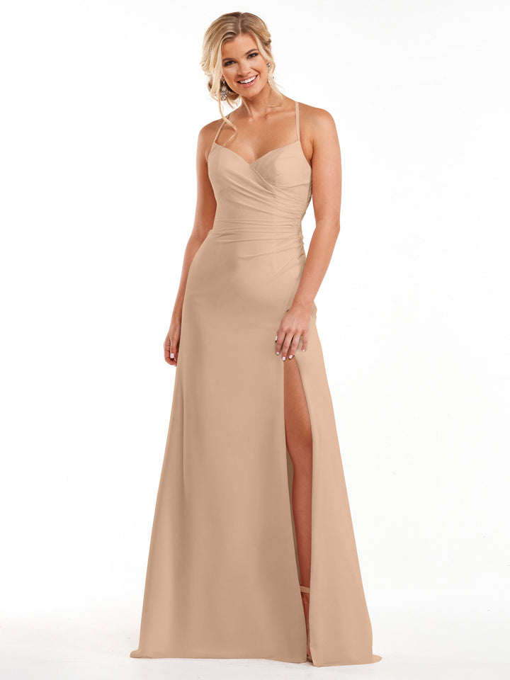 A woman smiles against a plain white background wearing the Avery Austin 80167 in Buff, a ruched chiffon bridesmaid dress with a sweetheart neckline, thin straps, and a thigh-high slit.