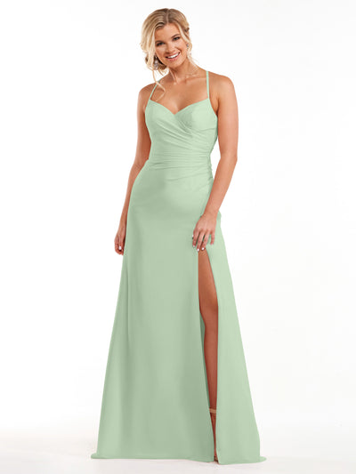 A woman models Avery Austin’s style 80167: a light mint green chiffon dress featuring spaghetti straps, a ruched bodice, sweetheart neckline, and thigh-high slit, as she smiles against a plain white background.