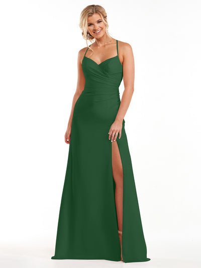 A woman in the Avery Austin 80167 hunter green chiffon dress, featuring spaghetti straps, a sleeveless floor-length design, and a thigh-high slit, stands smiling against a plain white background.