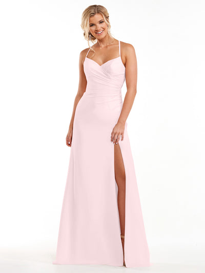 A woman wears Avery Austin's 80167 dress in Rose Petal, featuring chiffon fabric, a sweetheart neckline, spaghetti straps, and a high side slit, as she smiles against a plain white background.