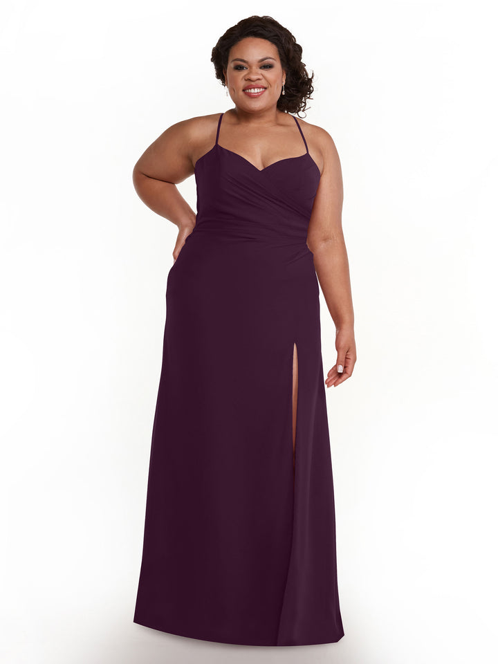 A woman smiles against a plain white background, modeling Avery Austin&