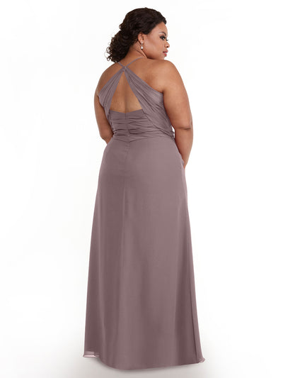 A woman models Avery Austin’s 80167— a sleeveless, floor-length mauve chiffon dress with a ruched back and halter neckline—while standing against a white background, glancing over her shoulder.