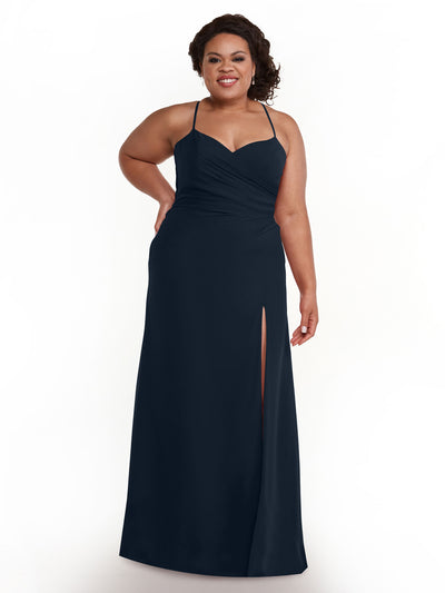 A woman wearing Avery Austin’s 80167 dress in Midnight—sleeveless chiffon with spaghetti straps, a sweetheart neckline, and thigh-high slit—smiles against a plain white background.