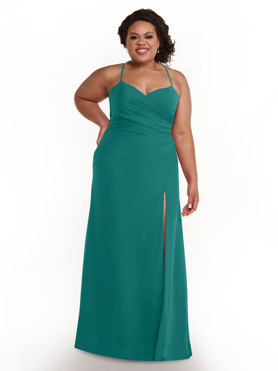 A woman wears Avery Austin's style 80167, a teal chiffon bridesmaid dress with ruching, spaghetti straps, sweetheart neckline, and a thigh-high slit. She smiles with one hand on her hip against a plain white background.