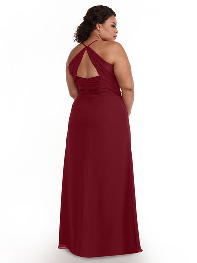 A woman stands facing away, looking over her shoulder, in the Avery Austin 80167: a floor-length burgundy chiffon dress with spaghetti straps and ruched detailing, set against a plain white background.