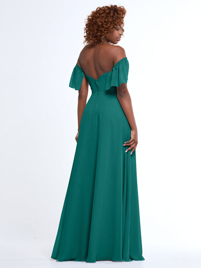 A woman stands facing away, showcasing Avery Austin's 80168—a teal chiffon, off-the-shoulder, floor-length gown with a flowing A-line skirt and ruffled sleeves—set against a plain white background.
