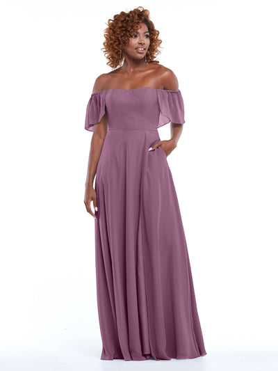Model showcasing Avery Austin’s 80168: a mauve chiffon off-the-shoulder A-line dress with a fitted bodice and flowing skirt, set against a plain white background.