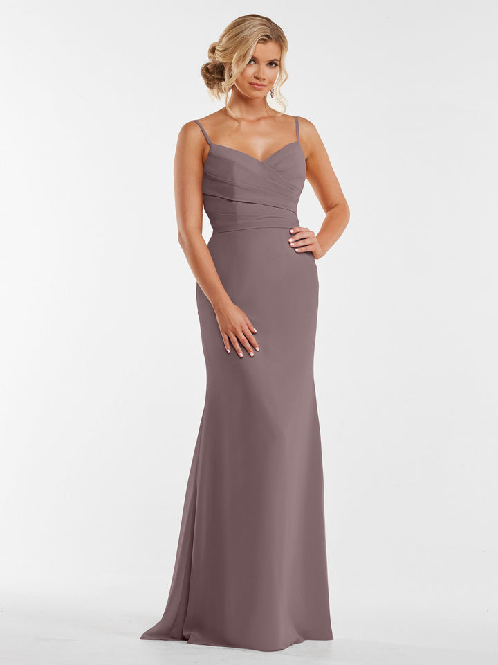A woman wearing Avery Austin’s 80169 chiffon dress featuring a pleated bodice.