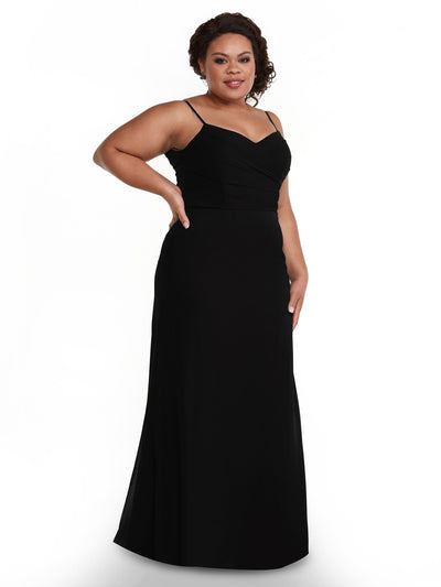 A woman smiles with one hand on her hip, modeling Avery Austin style 80169—a sleeveless, floor-length black chiffon dress with a pleated bodice and thin straps—against a white background.