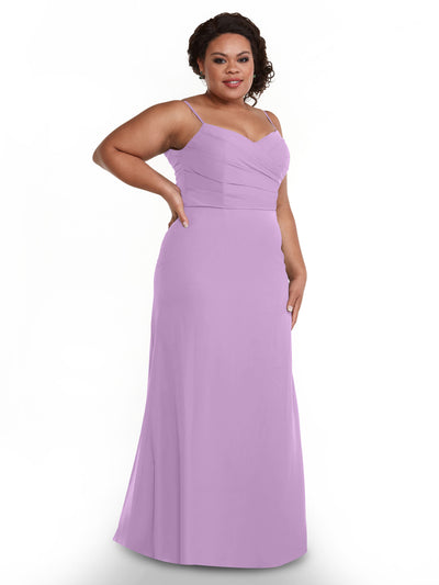 A woman poses confidently against a white background in Avery Austin’s 80169, a floor-length lavender chiffon dress featuring spaghetti straps, a sleeveless design, and a fitted pleated bodice.