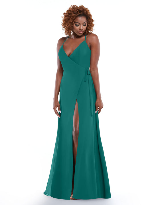 A woman models Avery Austin's 80171, a teal sleeveless sheath dress with a V-neckline, wrap bodice, high slit, and spaghetti straps. She poses against a white background, gazing down with a gentle expression.