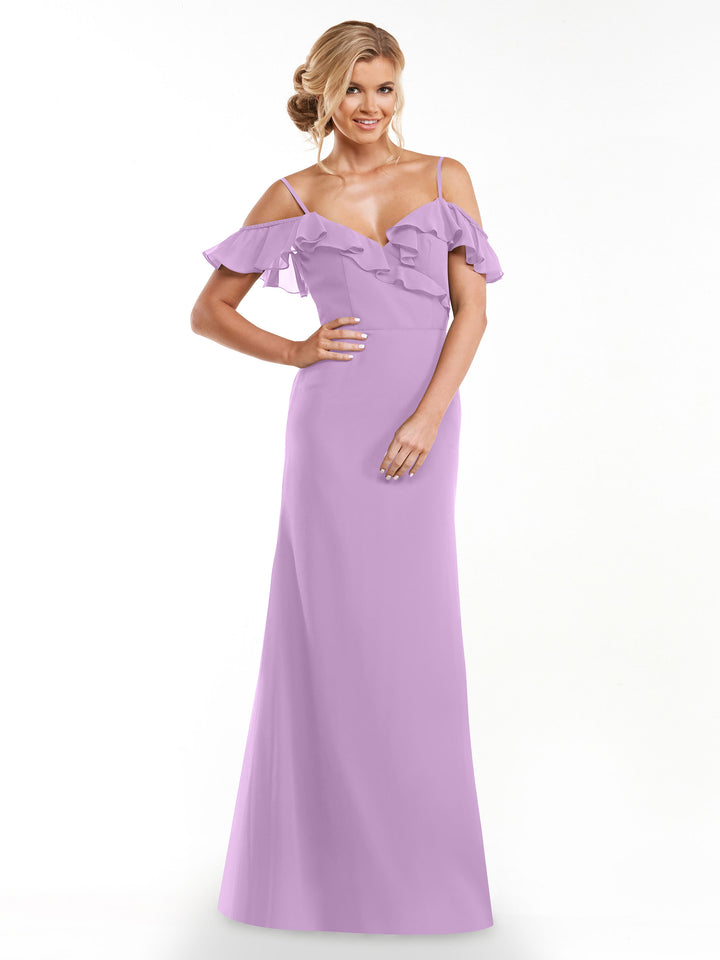 A woman models Avery Austin’s 80172, a long lilac A-line dress with ruffled off-the-shoulder sleeves and thin straps, posing with one hand on her hip against a plain white background.