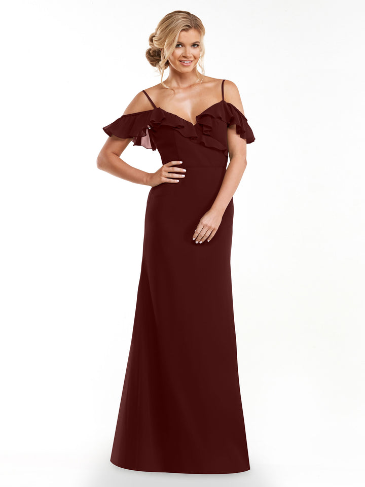 A woman smiles against a white background wearing Avery Austin’s 80172, an elegant A-line dress with off-the-shoulder sleeves, thin straps, and a ruffled neckline in rich burgundy.