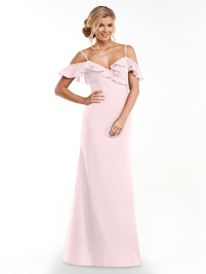 A woman smiles against a plain white background, wearing Avery Austin&