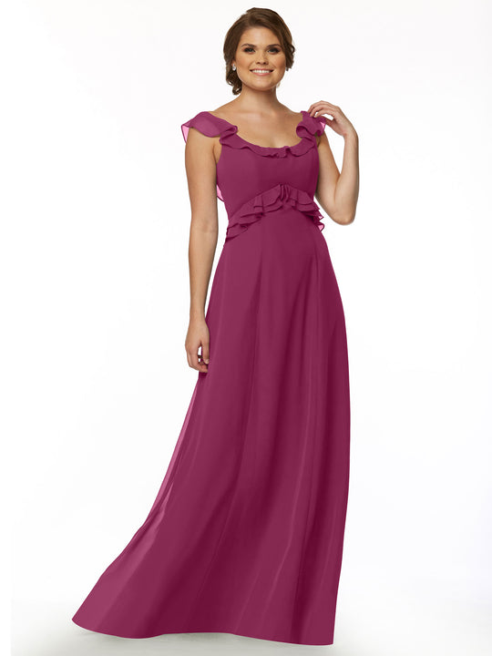 A woman stands and smiles in the Avery Austin 80173, a sleeveless, floor-length magenta dress with a ruffled neckline, shoulder details, and waist accents, set against a plain white background.