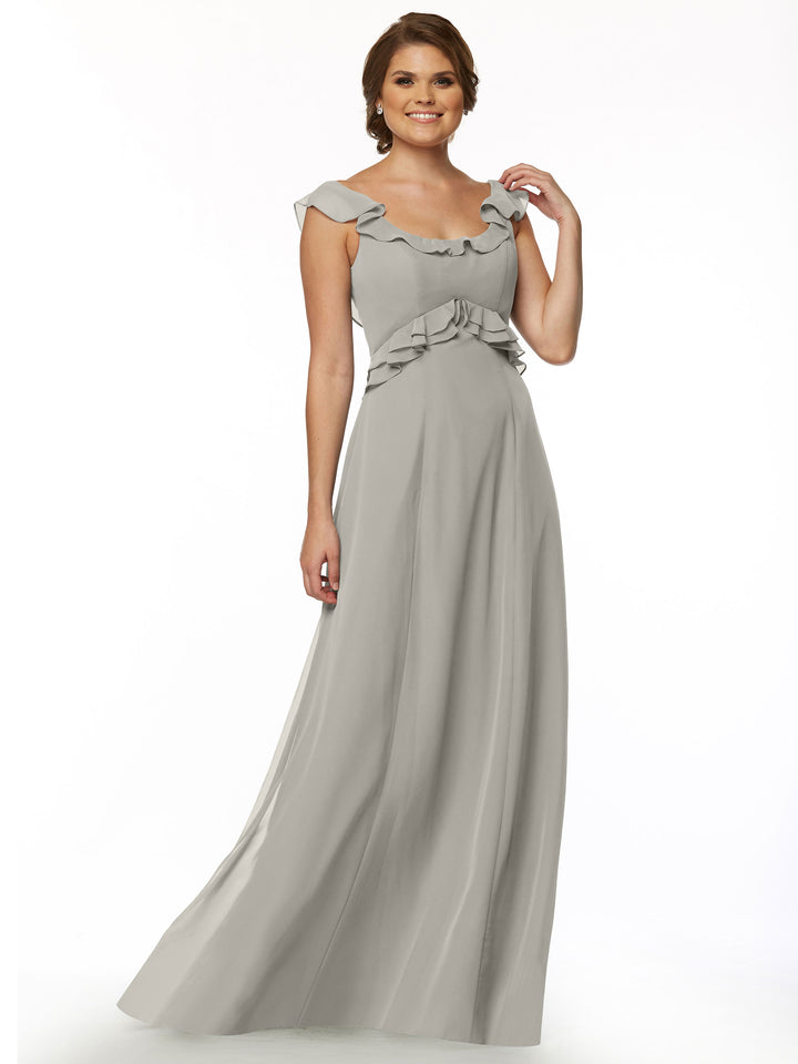 A woman smiles against a white background wearing the Avery Austin 80173 dress—a long, light gray gown with a ruffled neckline and sleeveless design.