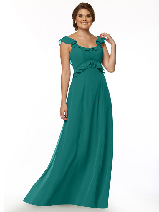 A woman with short brown hair smiles in front of a white background, modeling Avery Austin's floor-length dress (style 80173) in teal, featuring a ruffled neckline and waist detail.