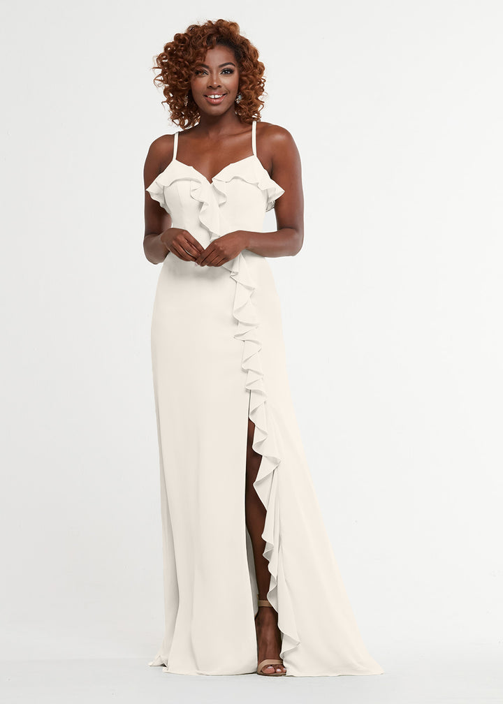 A woman smiles against a plain white background wearing Avery Austin&