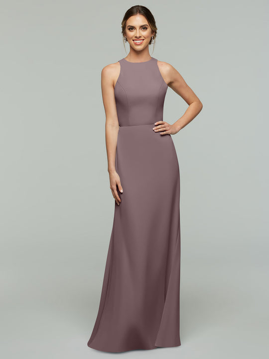 A woman smiles in the Avery Austin 80175, a sleeveless, floor-length mauve A-line dress with a fitted bodice and high neckline, set against a plain light gray background.