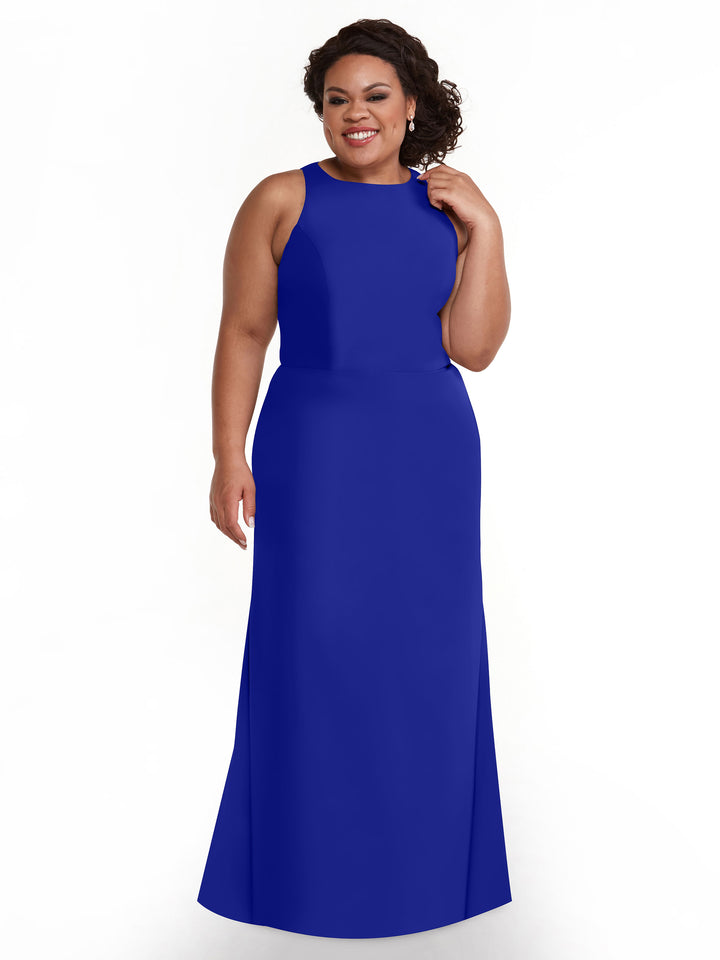 A smiling woman with curly dark hair wears the Avery Austin 80175 sleeveless, floor-length cobalt A-line dress, standing against a plain white background.