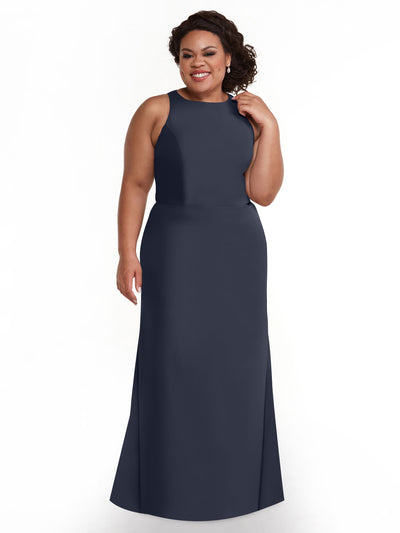 A woman with curly hair wears the Avery Austin 80175 sleeveless navy blue V-neck A-line dress with a floor-length hem, smiling against a plain white background.