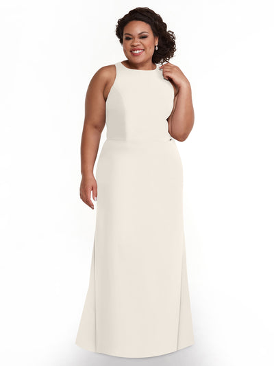 A woman with curly dark hair smiles while touching her hair, wearing Avery Austin’s floor-length ivory A-Line dress (style 80175) against a plain white background.