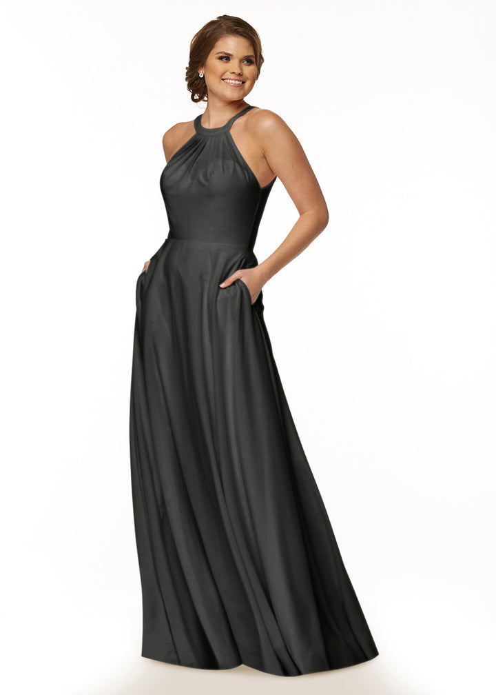 A woman wearing the Avery Austin TH-83002 sleeveless black A-line floor-length dress with a high neckline and pockets stands smiling against a plain white background.