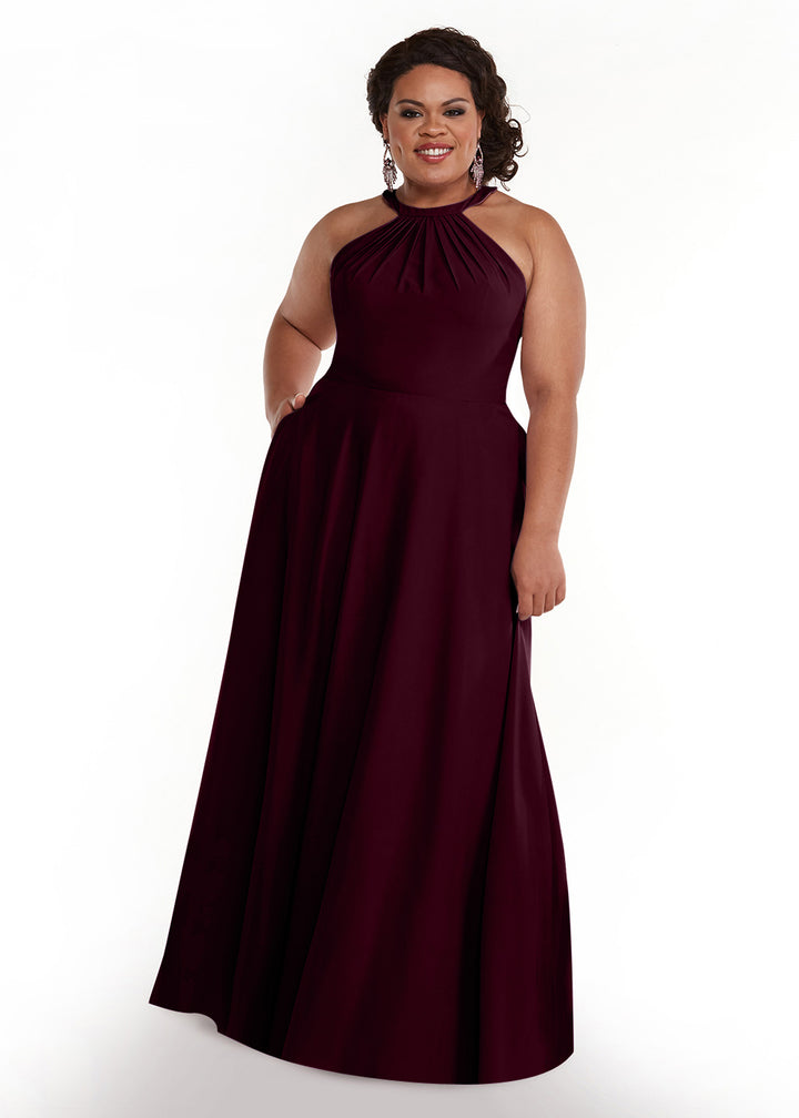 A woman in the Avery Austin TH-83002 sleeveless, floor-length, dark burgundy A-line halter dress smiles against a plain white background.