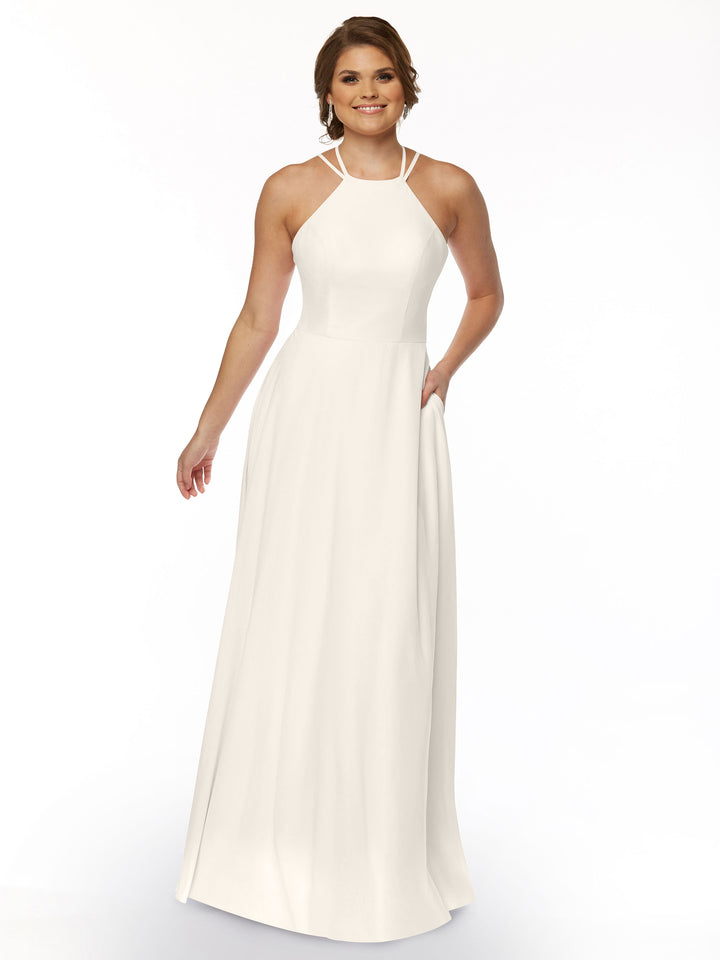 A woman in the Avery Austin 83006, a white A-line dress with a halter neckline.