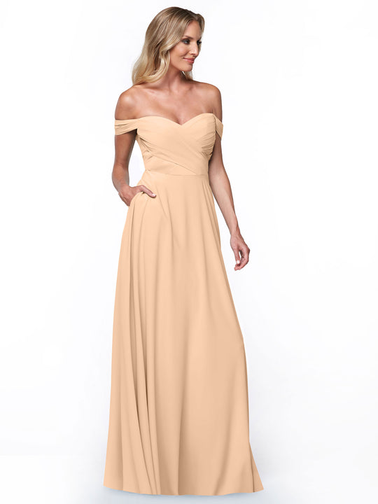 A woman models the Avery Austin 83018 off-the-shoulder dress, featuring a fitted bodice and an A-line skirt, against a plain white background.