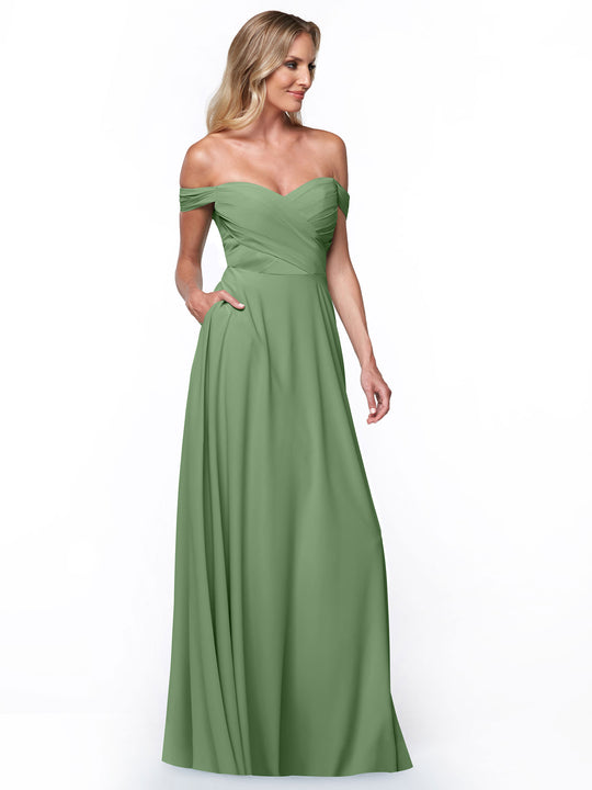 A woman models the Avery Austin TH-83018—a sage green, long, off-the-shoulder ruched dress with a fitted bodice and flowing A-line skirt—standing against a plain white background.