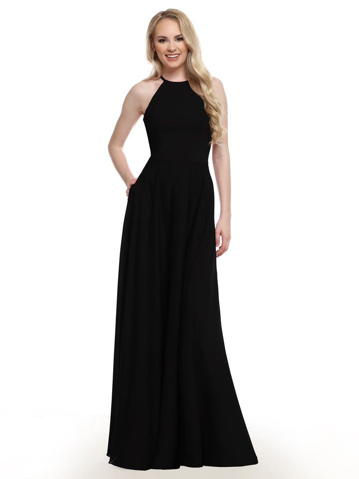 A woman with long blonde hair models Avery Austin’s 83022, a sleeveless, floor-length black gown with an A-line skirt, smiling against a plain white background.