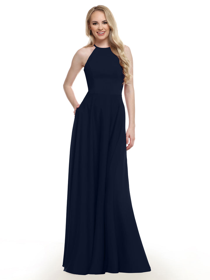 A woman wears Avery Austin 83022, a blue dress with a halter neckline.