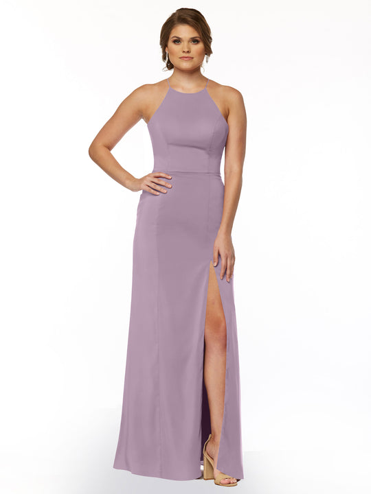 A woman poses with one hand on her hip against a white background, wearing the Avery Austin 83026: a sleeveless lavender sheath dress featuring a halter neck and thigh-high front slit.