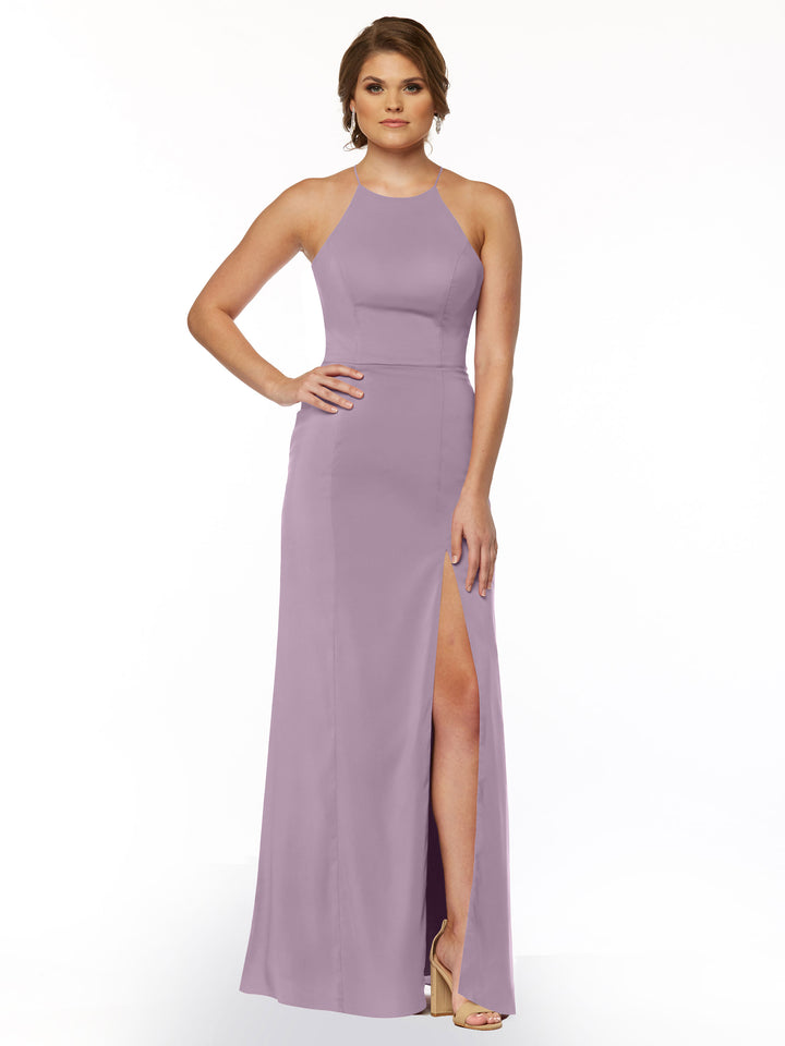 A woman poses with one hand on her hip against a white background, wearing the Avery Austin 83026: a sleeveless lavender sheath dress featuring a halter neck and thigh-high front slit.