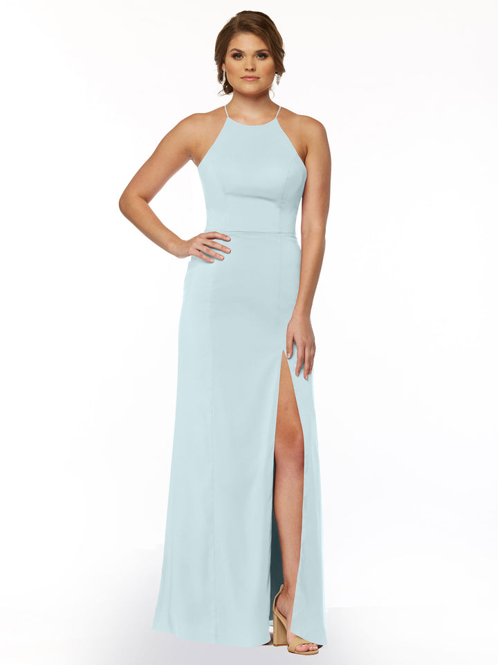 A woman in the Avery Austin 83026 sleeveless sheath dress in Sky Blue, featuring a high neckline and thigh-high slit, poses with one hand on her hip and nude heels against a white background.